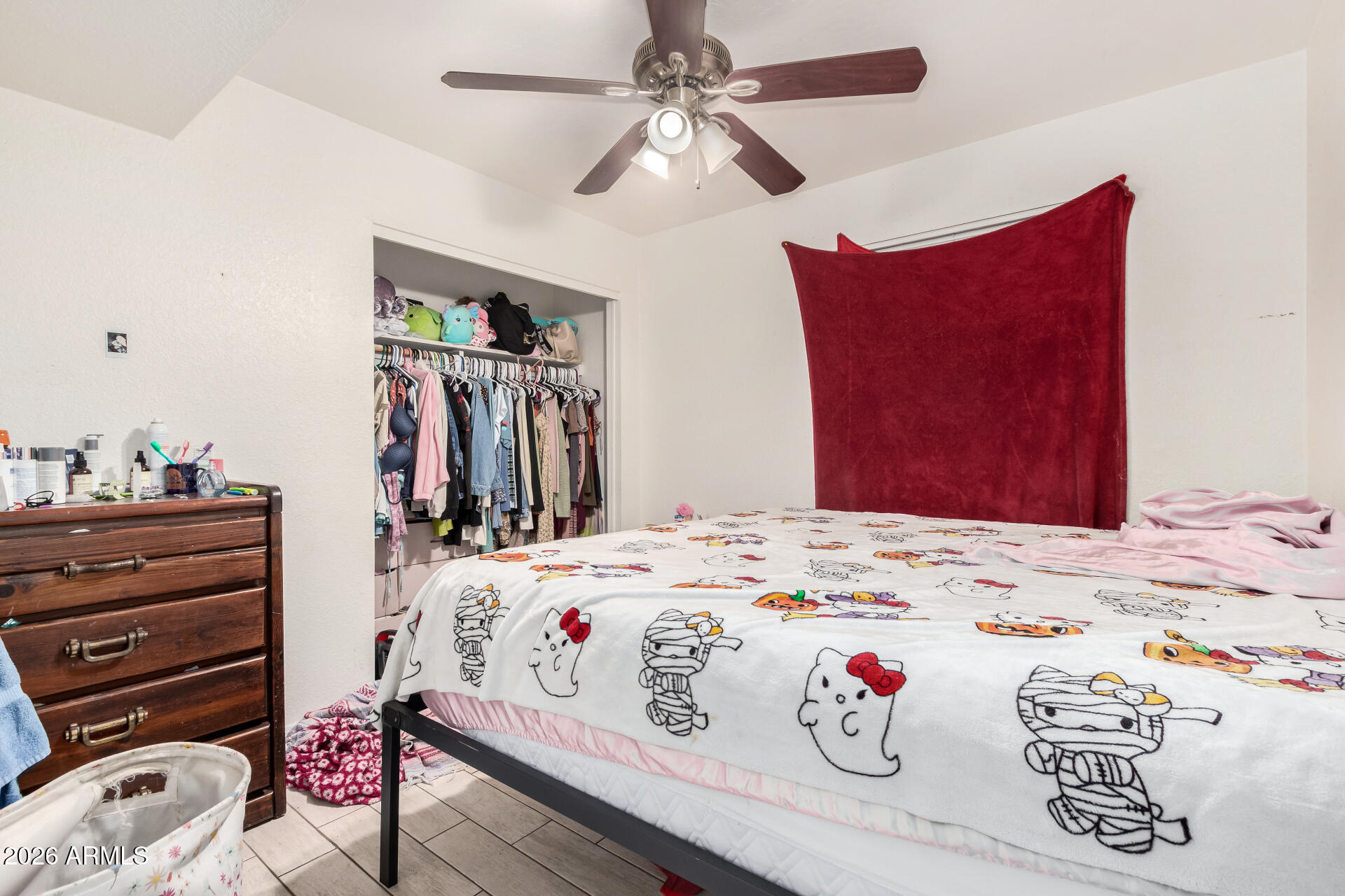 7522 West Cheery Lynn Road Phoenix, AZ 85033 - Photo 9 of 14 a bedroom with a bed and a dresser in it