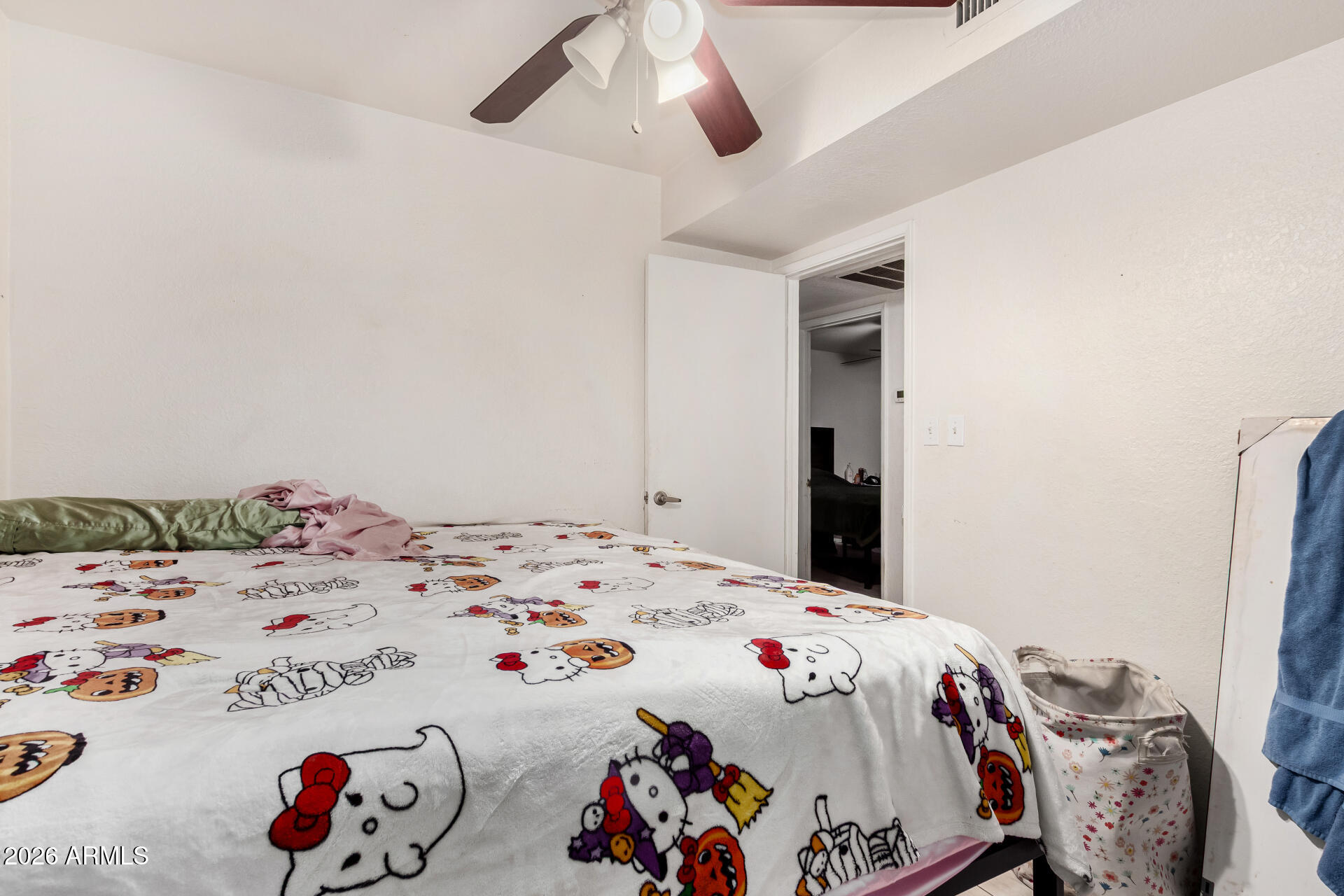 7522 West Cheery Lynn Road Phoenix, AZ 85033 - Photo 10 of 14 a bedroom with a bed and a dresser