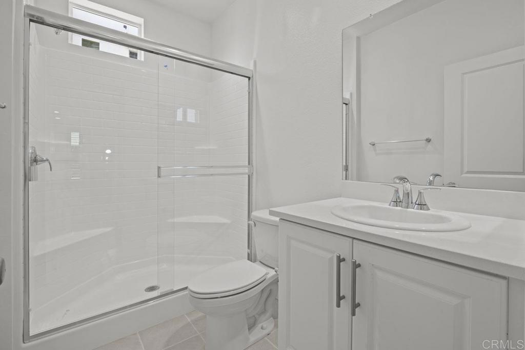 520 Cobblestone Court El Cajon, CA 92020 - Photo 15 of 24 a bathroom with a granite countertop sink toilet and shower