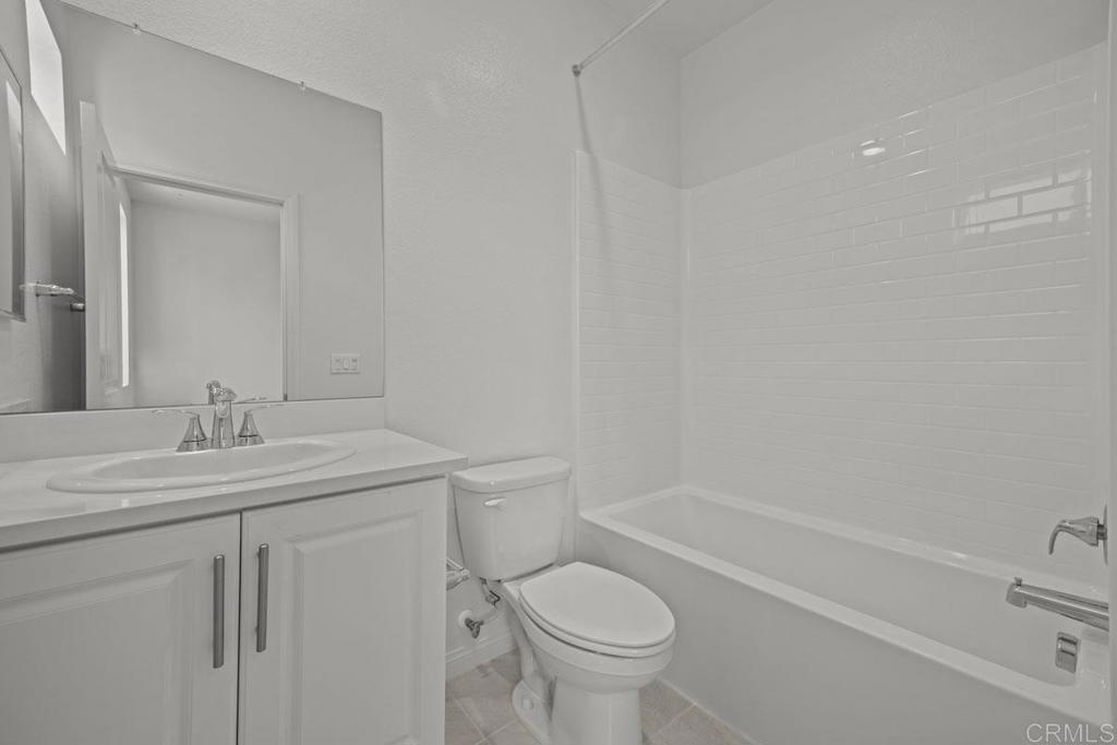 520 Cobblestone Court El Cajon, CA 92020 - Photo 19 of 24 a bathroom with a sink toilet vanity and tub