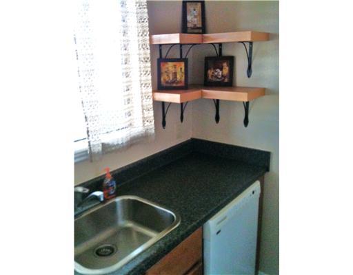 7122 Premont Drive, Unit C104 Corpus Christi, TX 78414 - Photo 4 of 9 a bathroom with a sink and a mirror