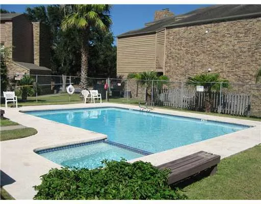 a view of a backyard with sitting area