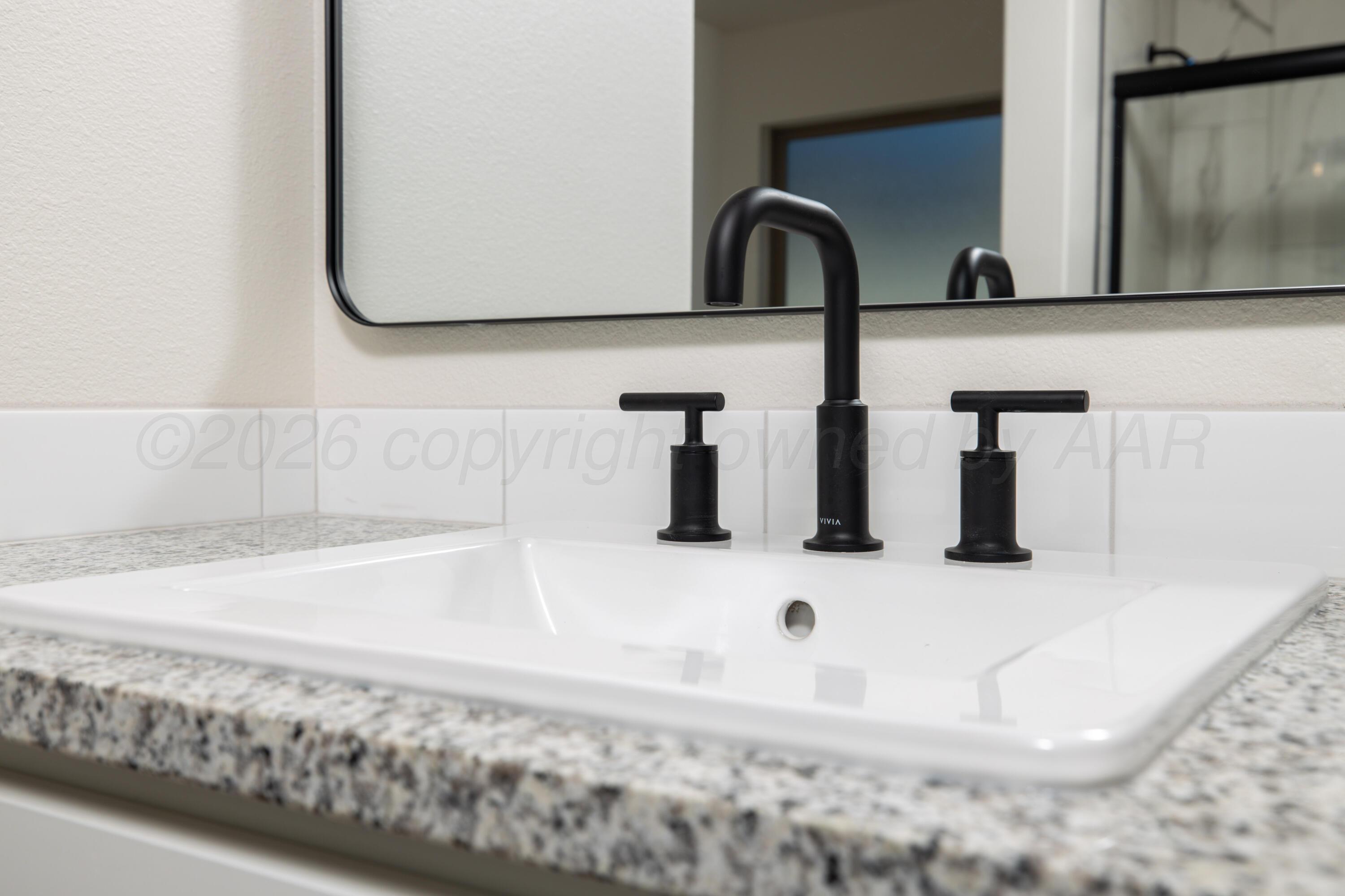 3000 Flycatcher Road Amarillo, TX 79124 - Photo 7 of 11 a bathroom with a sink and a mirror