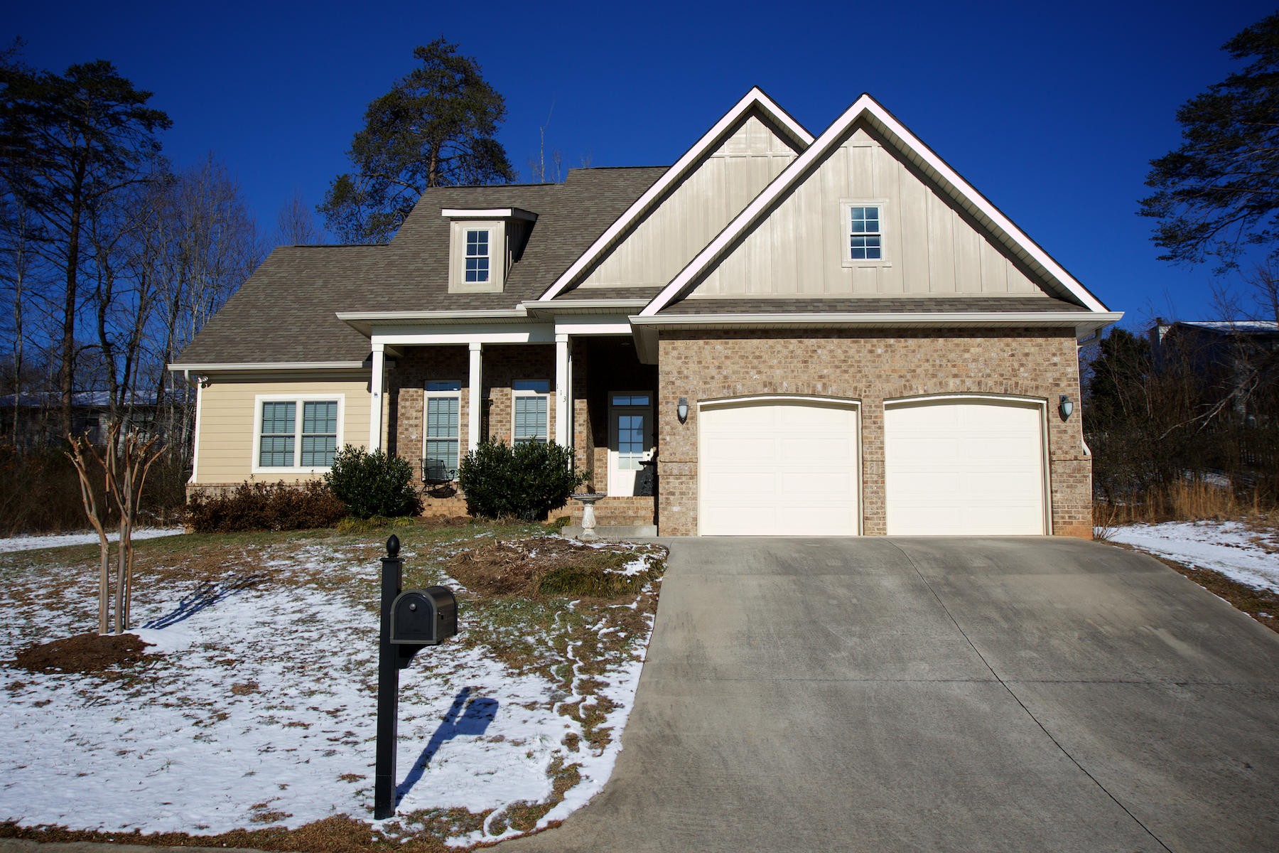 113 Crossroads Boulevard Oak Ridge, TN 37830 - Photo 1 of 24 a front view of a house with a yard and garage