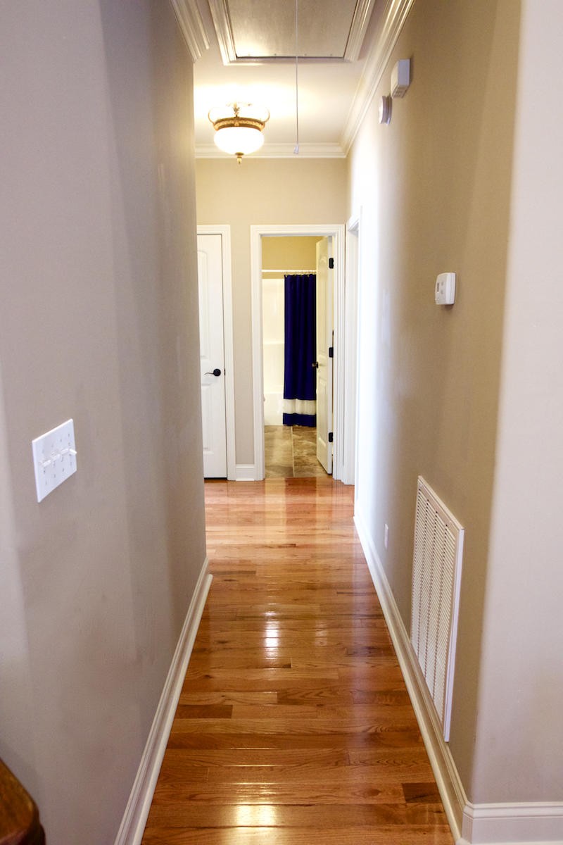 113 Crossroads Boulevard Oak Ridge, TN 37830 - Photo 13 of 24 a hallway view with wooden floor and staircase