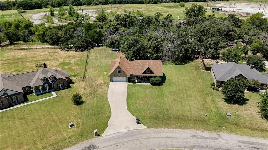 181 Savannah Drive Weatherford, TX 76087 - Photo 2 of 36 an aerial view of a house with a swimming pool