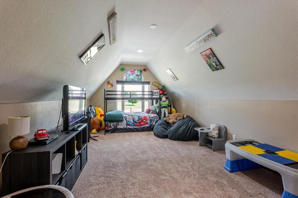 181 Savannah Drive Weatherford, TX 76087 - Photo 21 of 36 a bedroom with furniture and a window