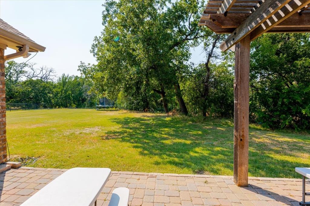 181 Savannah Drive Weatherford, TX 76087 - Photo 24 of 36 a view of a yard with an outdoor space