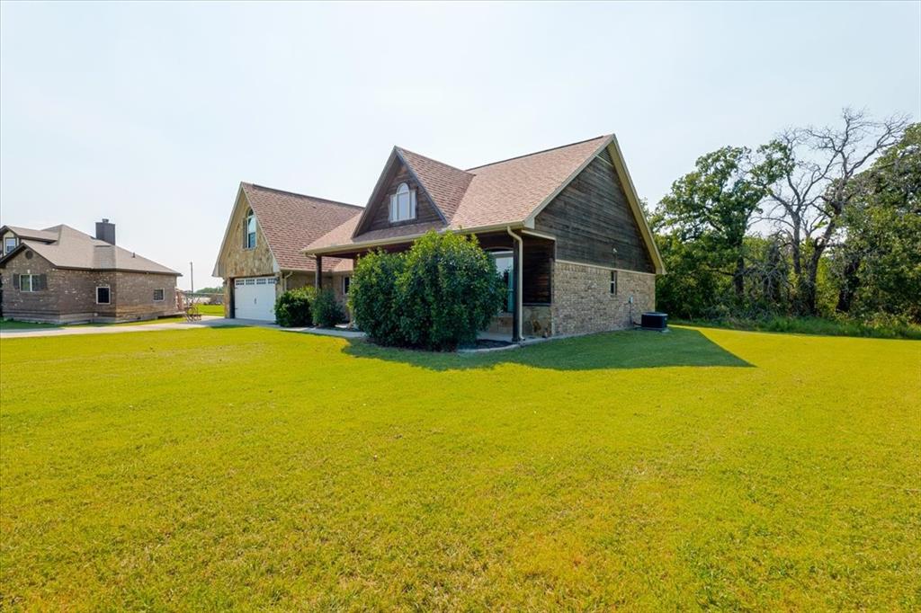 181 Savannah Drive Weatherford, TX 76087 - Photo 28 of 36 a view of a house with swimming pool and yard
