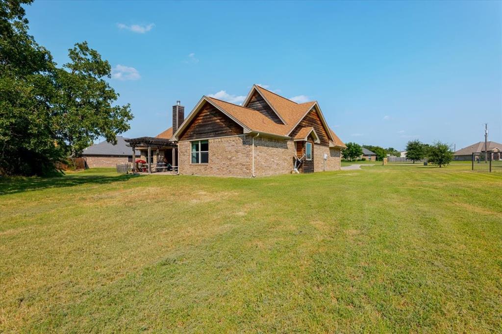 181 Savannah Drive Weatherford, TX 76087 - Photo 30 of 36 a view of a house with a big yard