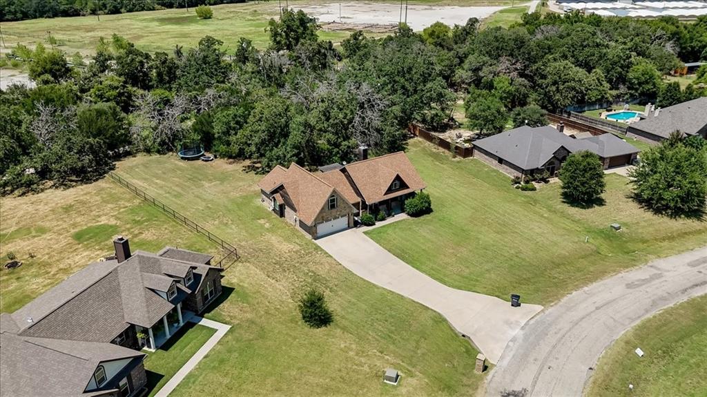 181 Savannah Drive Weatherford, TX 76087 - Photo 31 of 36 an aerial view of a house with a yard