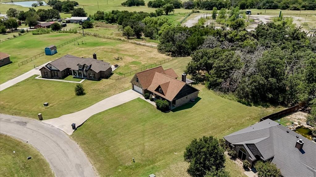 181 Savannah Drive Weatherford, TX 76087 - Photo 33 of 36 an aerial view of a house with yard swimming pool and outdoor seating