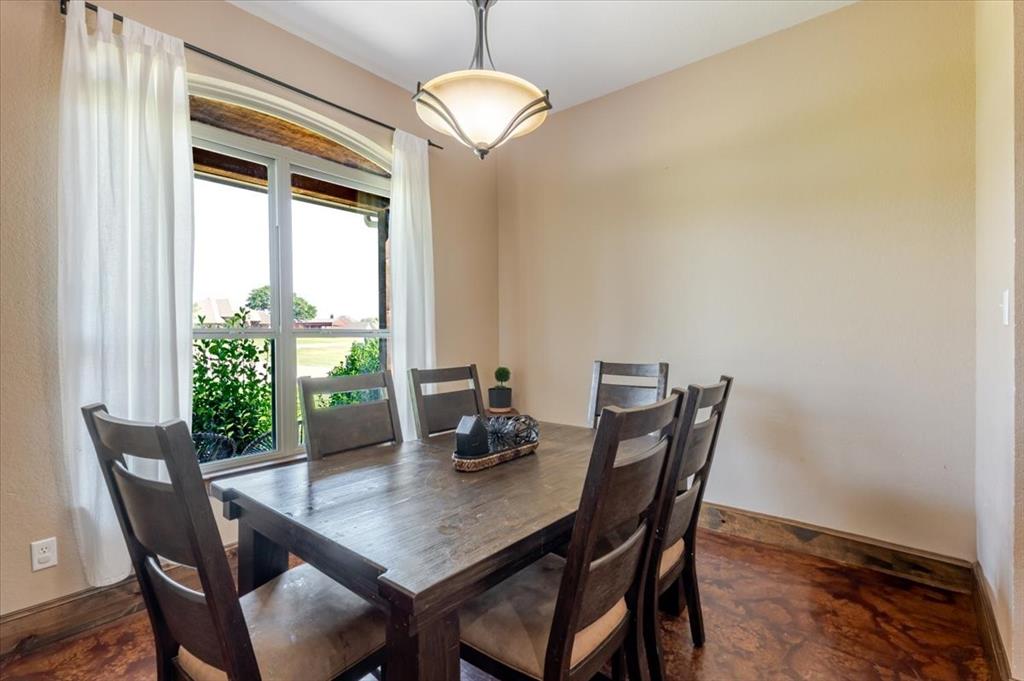 181 Savannah Drive Weatherford, TX 76087 - Photo 6 of 36 a view of a dining room with furniture window and outside view
