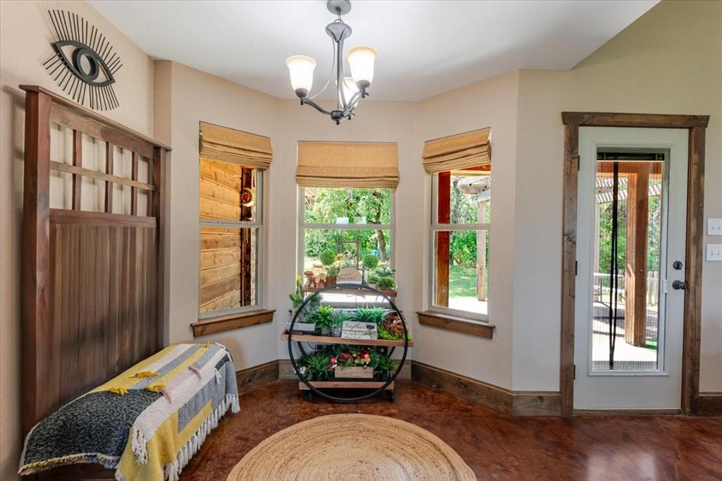 181 Savannah Drive Weatherford, TX 76087 - Photo 9 of 36 a bedroom with bed and a window