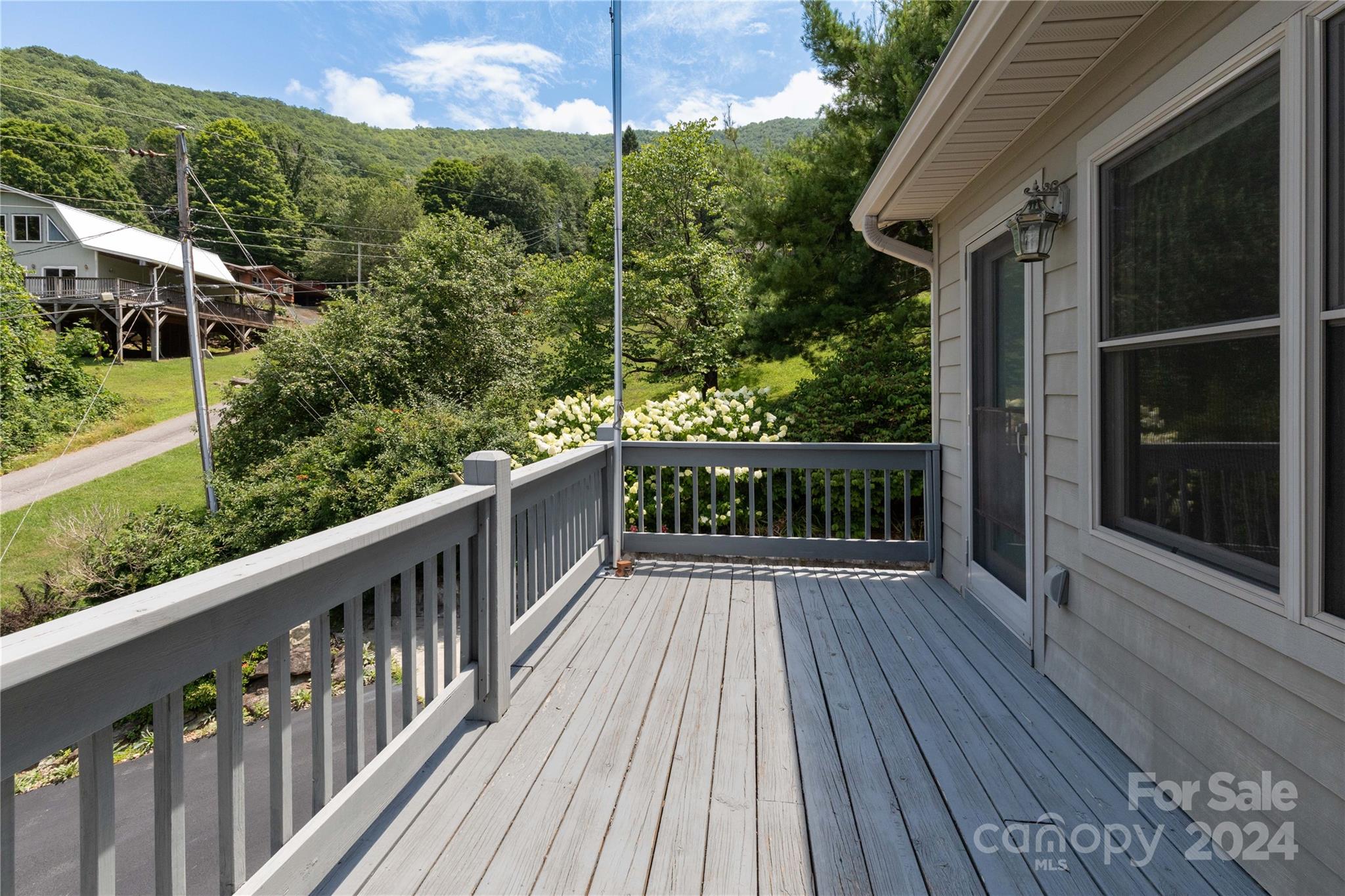 164 Atari Road Waynesville, NC 28786 - Photo 22 of 36 a view of a wooden deck