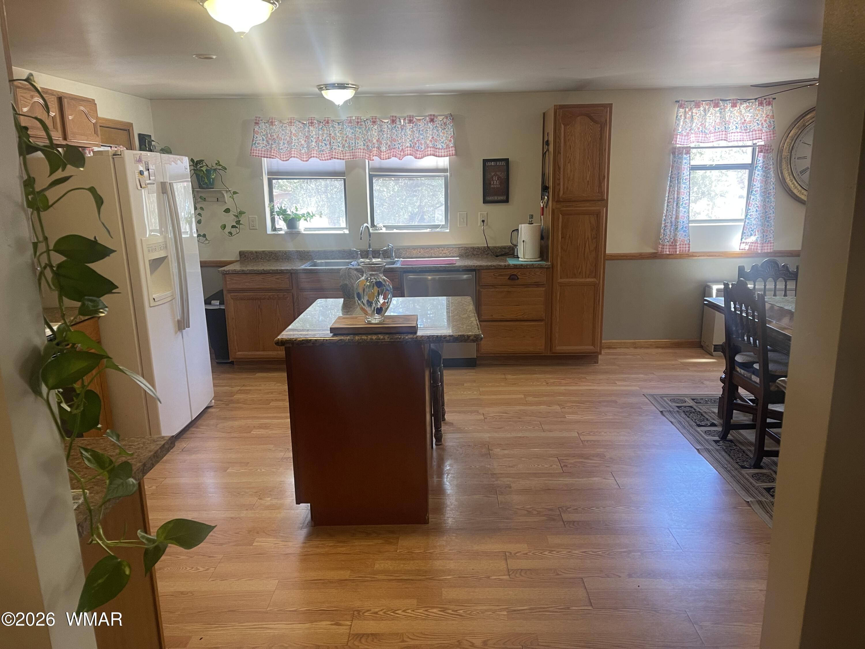 2871 Moose Trail Overgaard, AZ 85933 - Photo 6 of 25 a kitchen with stainless steel appliances granite countertop a refrigerator and a sink