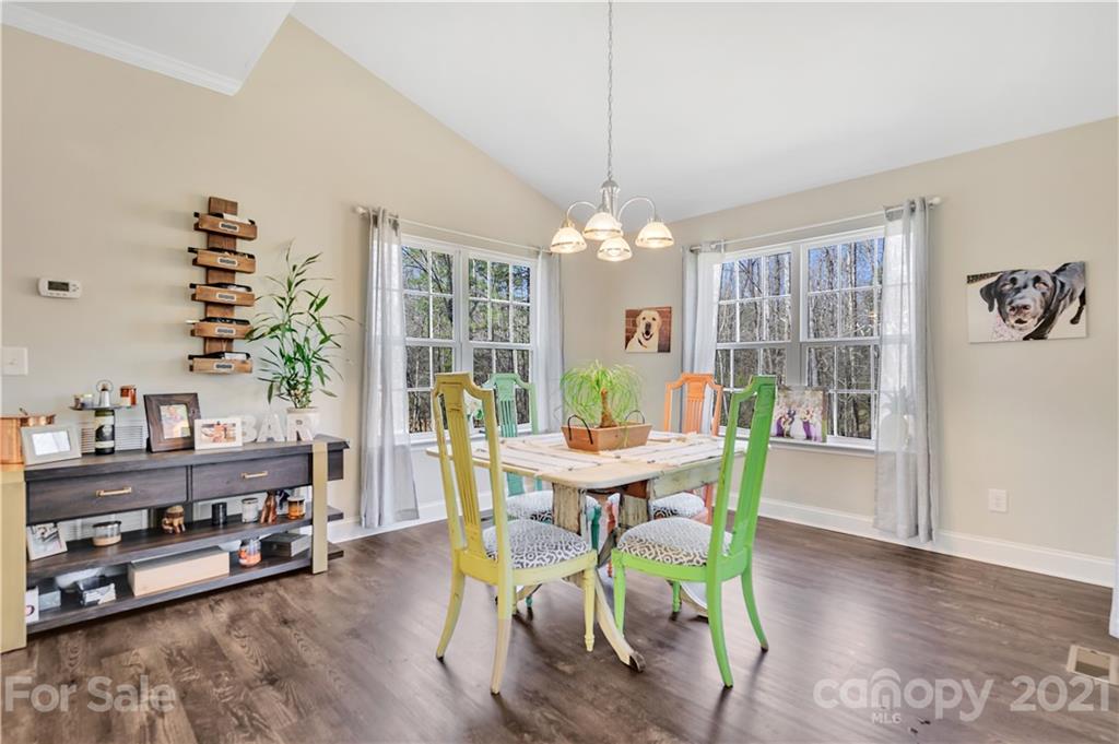 4081 Ruston Creek Road Catawba, SC 29704 - Photo 11 of 38 a view of a dining room with furniture window and wooden floor