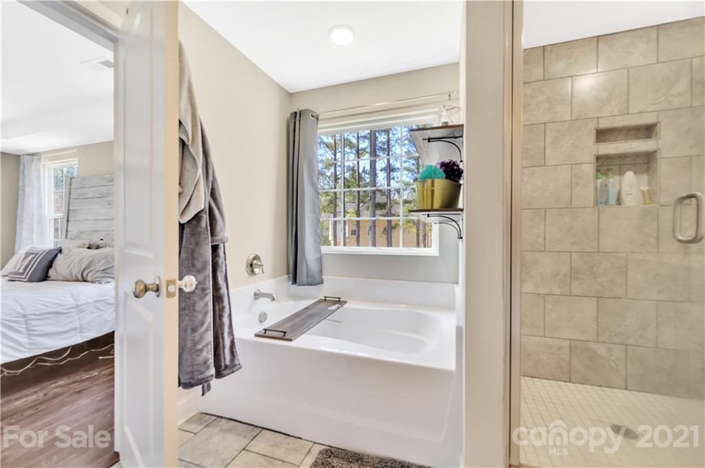 4081 Ruston Creek Road Catawba, SC 29704 - Photo 19 of 38 a bathroom with a tub sink and mirror