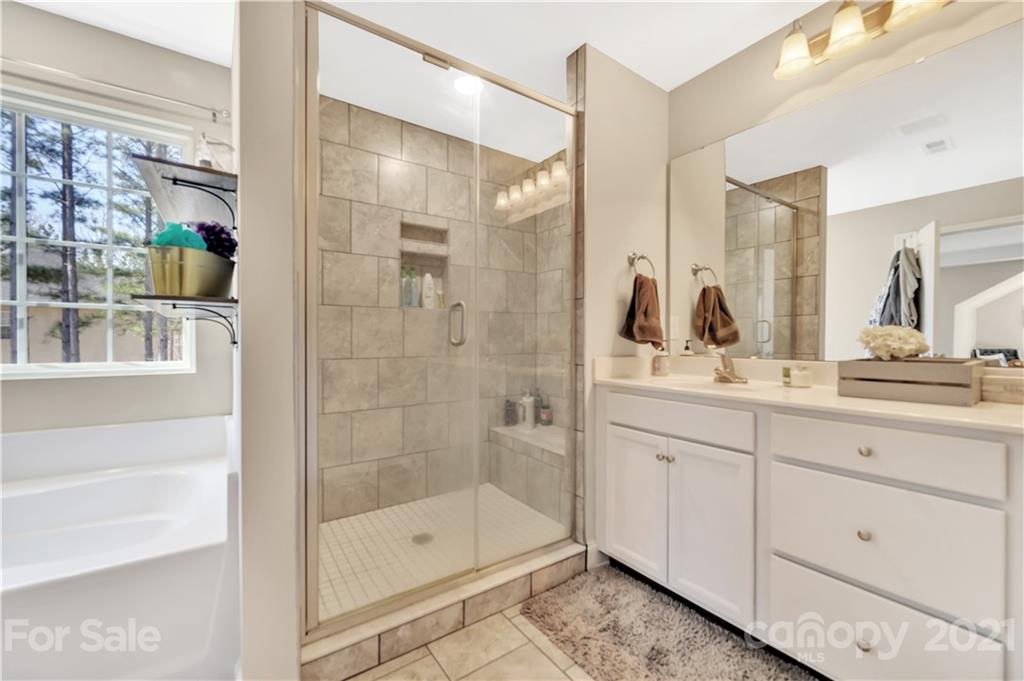 4081 Ruston Creek Road Catawba, SC 29704 - Photo 20 of 38 a bathroom with a shower sink and mirror