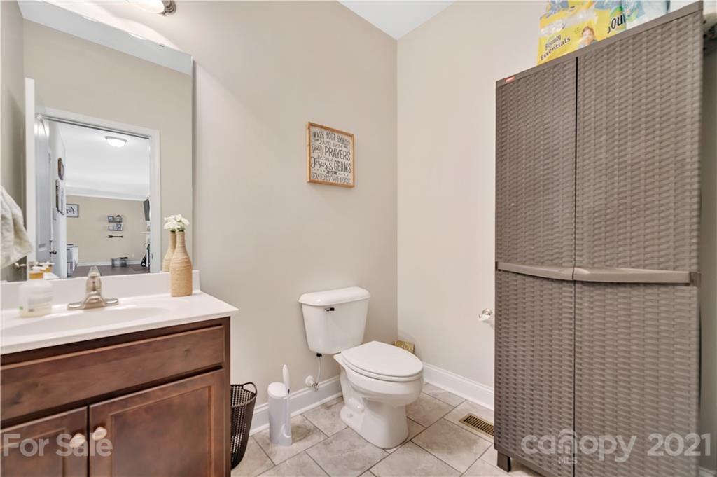 4081 Ruston Creek Road Catawba, SC 29704 - Photo 23 of 38 a bathroom with a toilet a sink and mirror