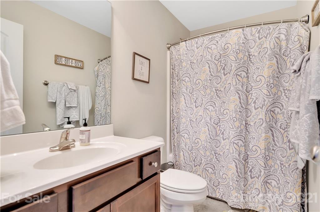4081 Ruston Creek Road Catawba, SC 29704 - Photo 25 of 38 a bathroom with a sink toilet and a mirror