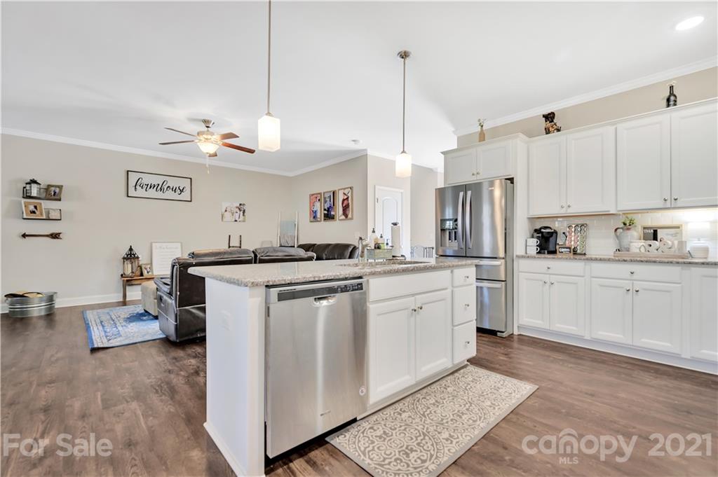 4081 Ruston Creek Road Catawba, SC 29704 - Photo 6 of 38 a kitchen that has a lot of white cabinets and stainless steel appliances