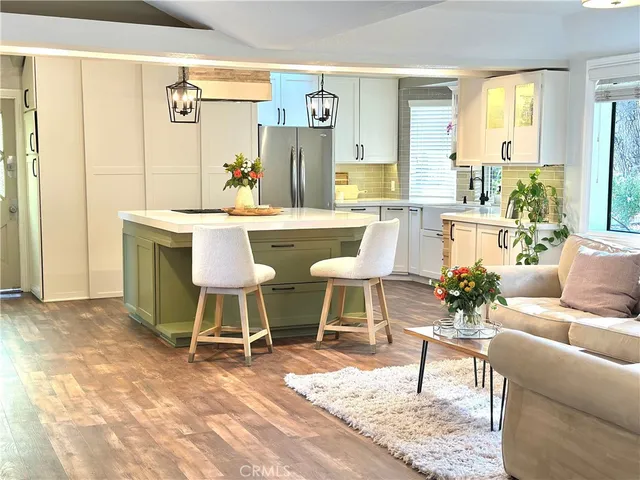 a living room with a couch and a dining table