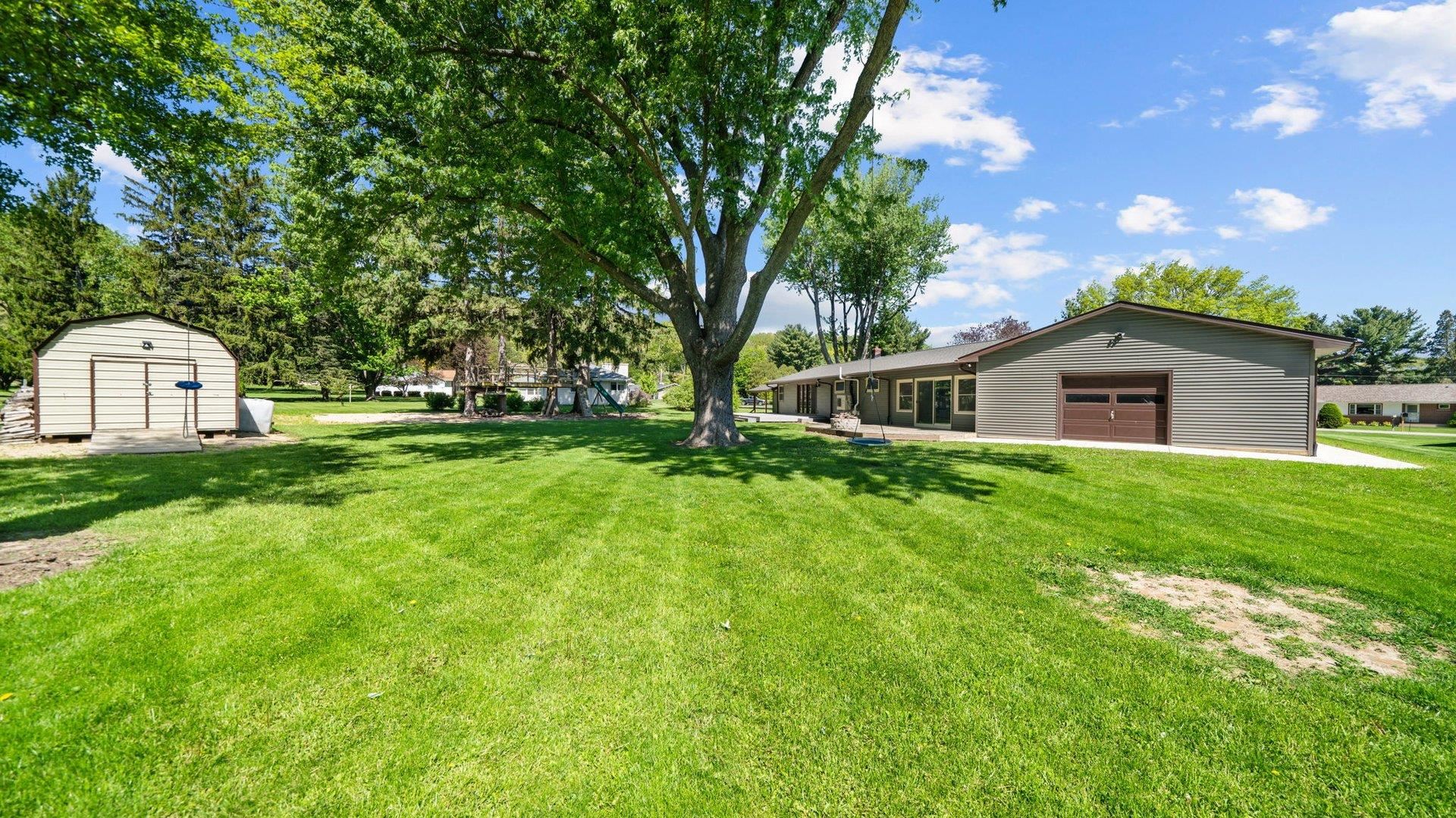 313 West Margaret Fuller Road Oregon, IL 61061 - Photo 40 of 46 a house view with a garden space