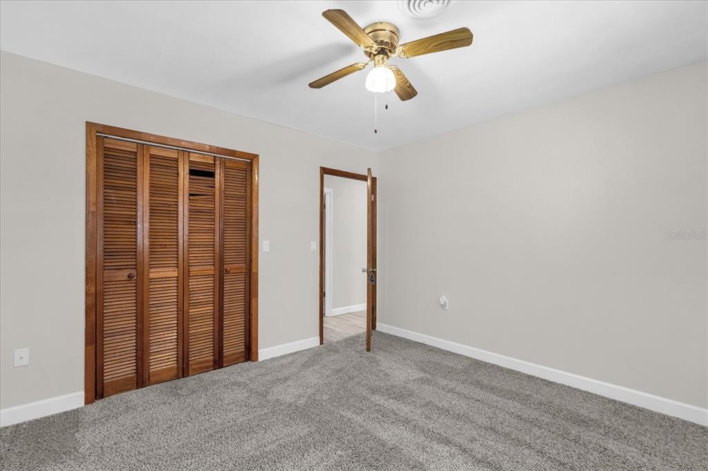 3800 Pine Street Cocoa, FL 32926 - Photo 14 of 31 an empty room with a empty space and a ceiling fan