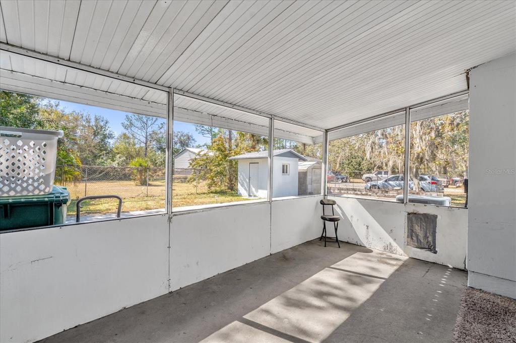 3800 Pine Street Cocoa, FL 32926 - Photo 22 of 31 a kitchen with a large window a sink and cabinets