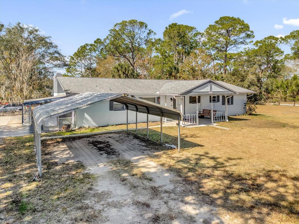 3800 Pine Street Cocoa, FL 32926 - Photo 4 of 31 a house with trees in the background