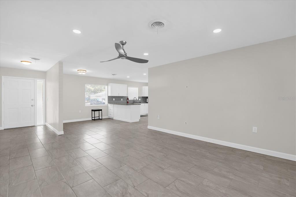 3800 Pine Street Cocoa, FL 32926 - Photo 8 of 31 a view of a kitchen with a sink and a refrigerator