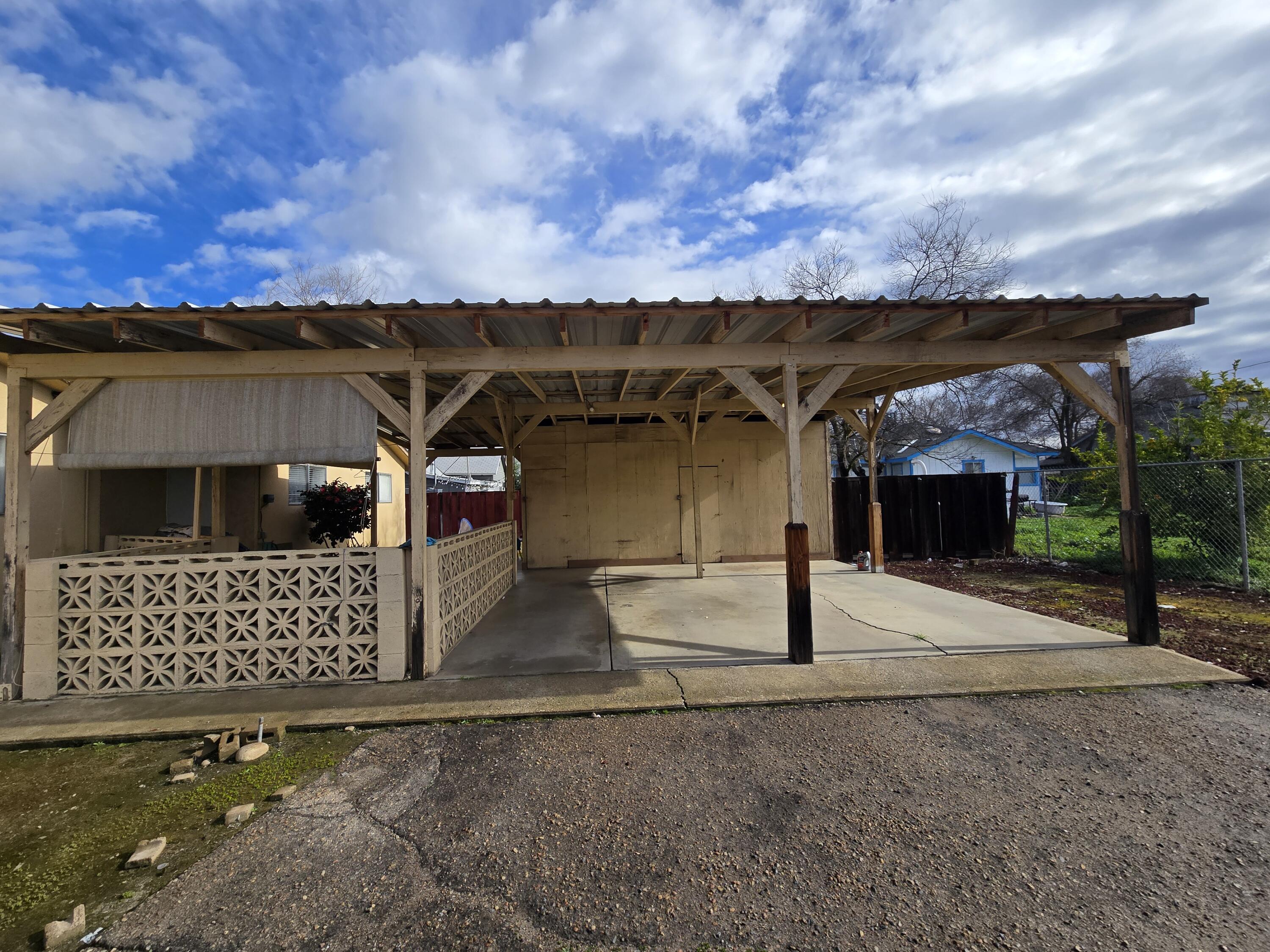 2222-2224 11th Street Reedley, CA 93654 - Photo 6 of 11 a view of a house with backyard