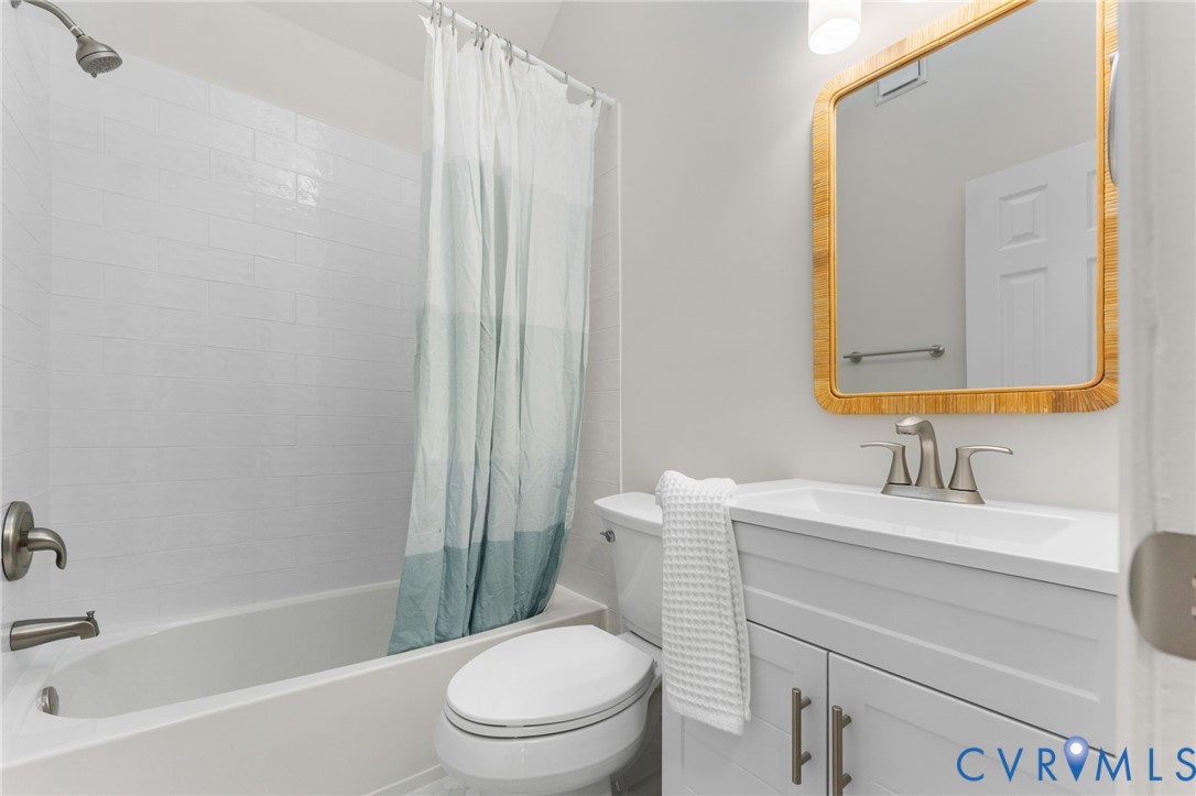 10209 Stonemill Road Henrico, VA 23233 - Photo 17 of 28 a bathroom with a sink toilet and shower