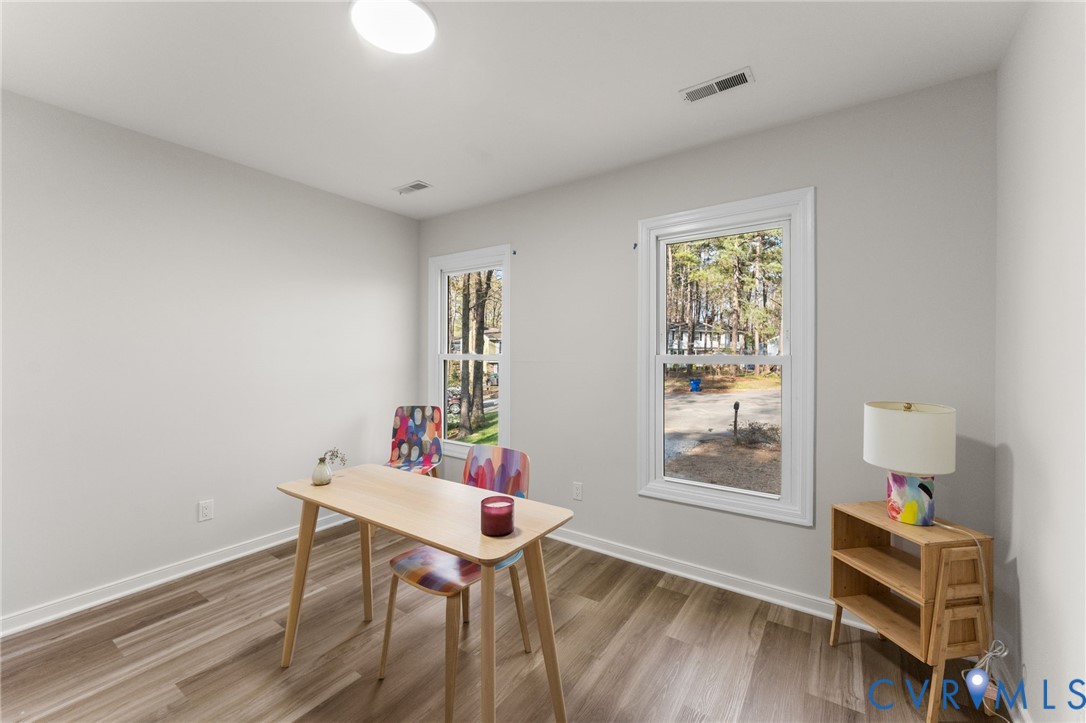10209 Stonemill Road Henrico, VA 23233 - Photo 21 of 28 a workspace room with furniture and wooden floor