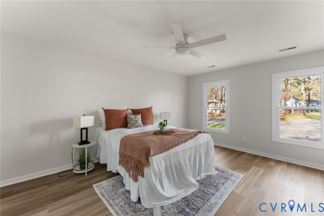 10209 Stonemill Road Henrico, VA 23233 - Photo 22 of 28 a bedroom with a bed and a window