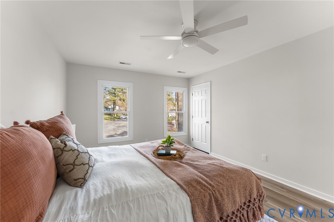 10209 Stonemill Road Henrico, VA 23233 - Photo 23 of 28 a bedroom with a bed and window