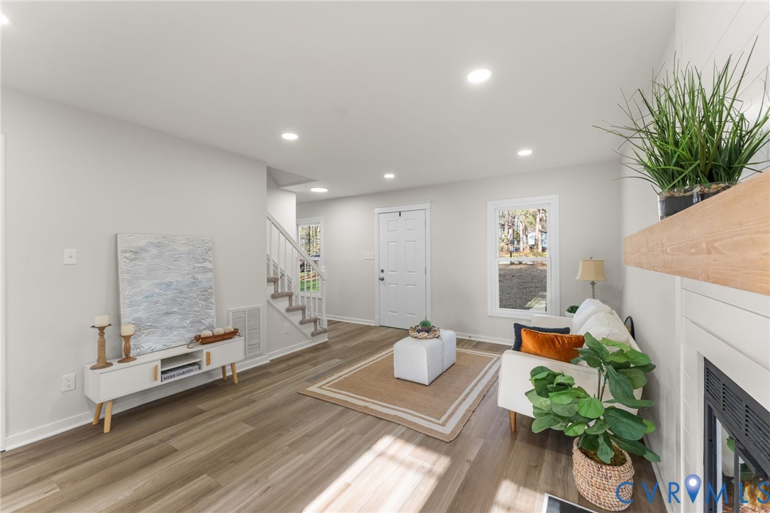10209 Stonemill Road Henrico, VA 23233 - Photo 6 of 28 a living room with furniture and a potted plant