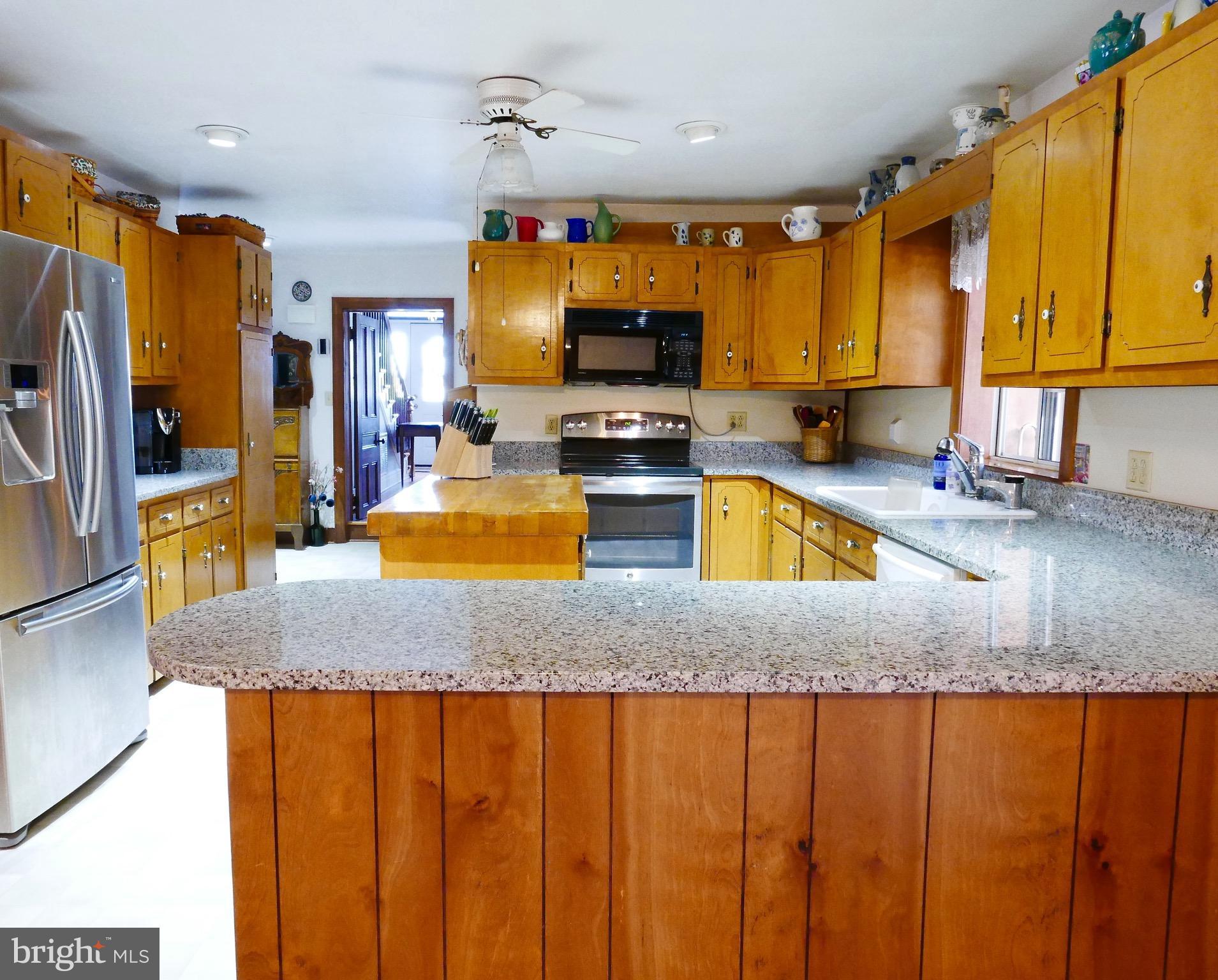 2978 Back Landing Road Preston, MD 21655 - Photo 10 of 30 Butcher block island and granite counters