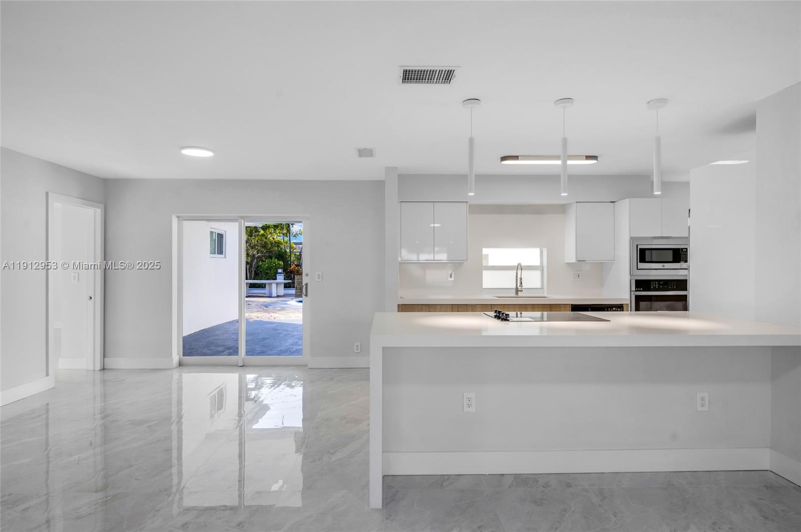 4500 Monroe Street Hollywood, FL 33021 - Photo 11 of 67 a view of kitchen with kitchen island and stainless steel appliances