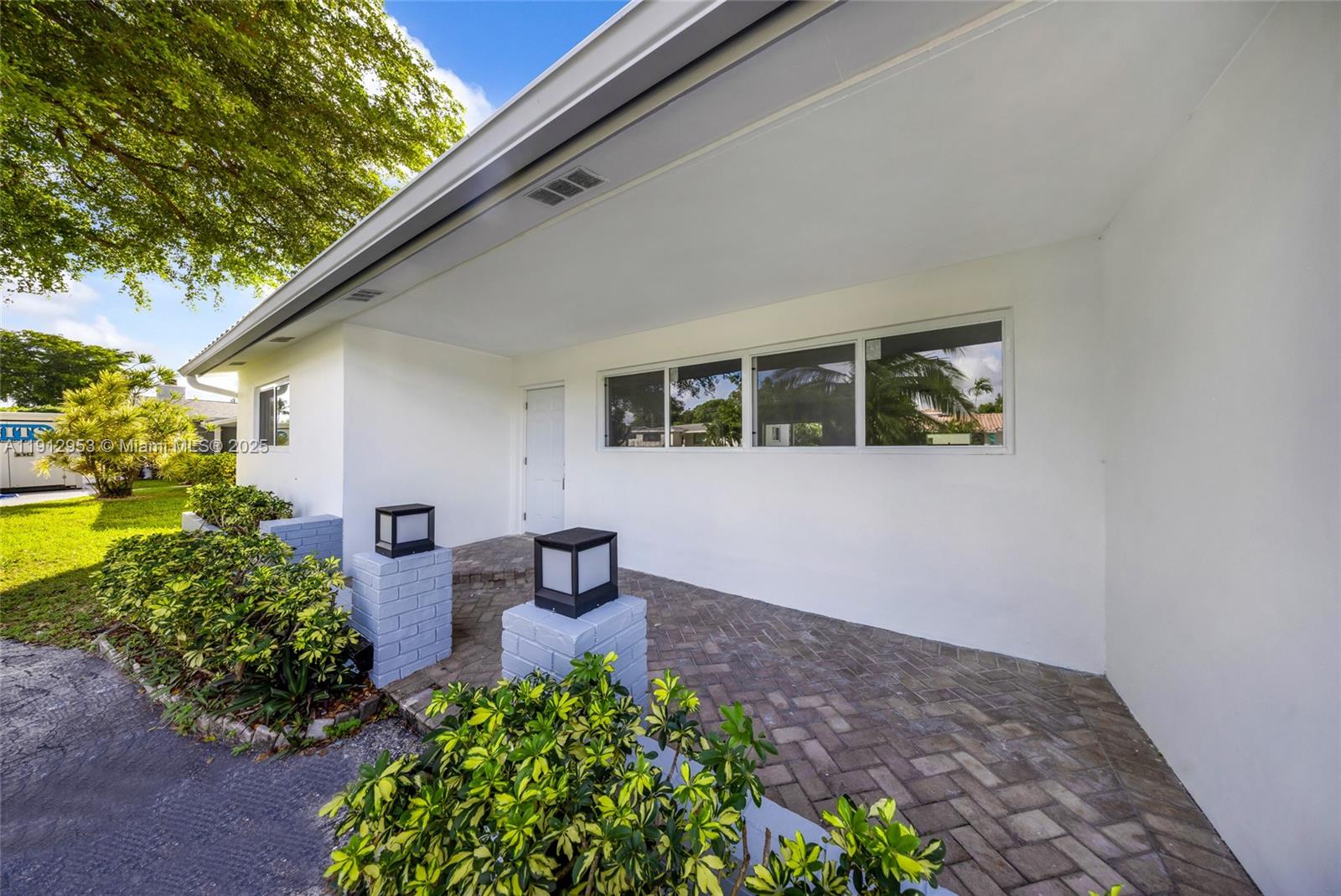 4500 Monroe Street Hollywood, FL 33021 - Photo 2 of 67 a view of a backyard with plants and a patio