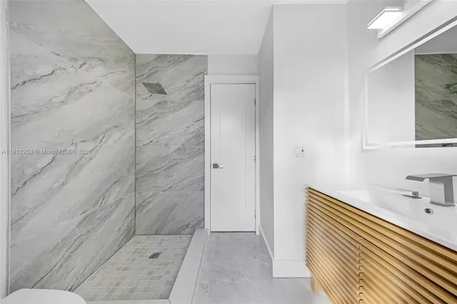 a bathroom with a bathtub and shower