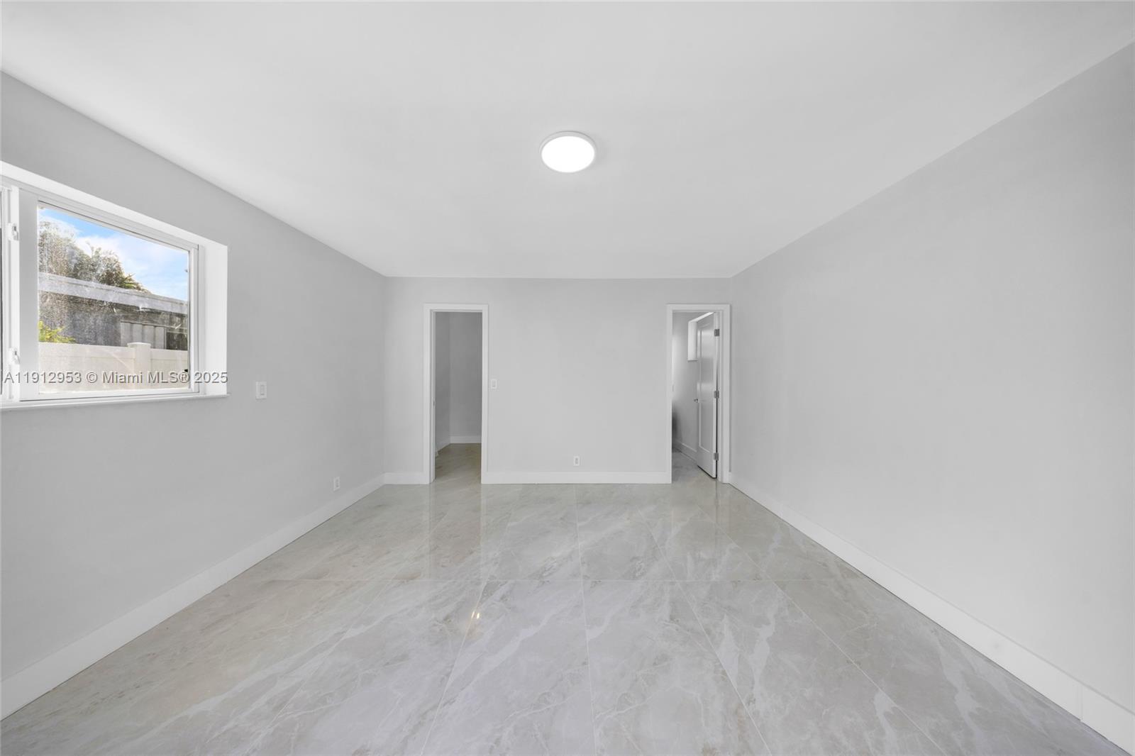 4500 Monroe Street Hollywood, FL 33021 - Photo 35 of 67 a view of an empty room with a window