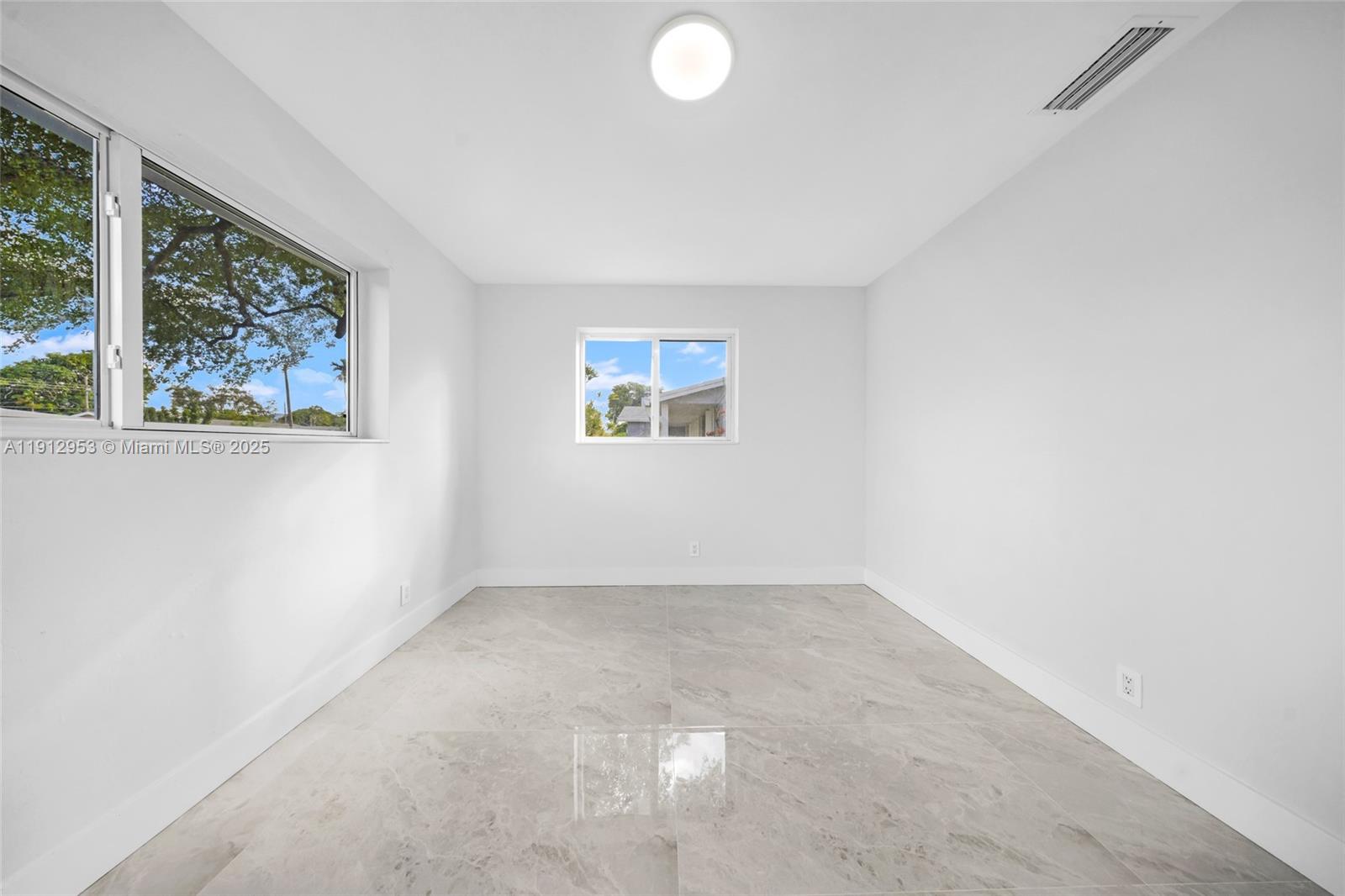 4500 Monroe Street Hollywood, FL 33021 - Photo 46 of 67 an empty room with windows and painted walls