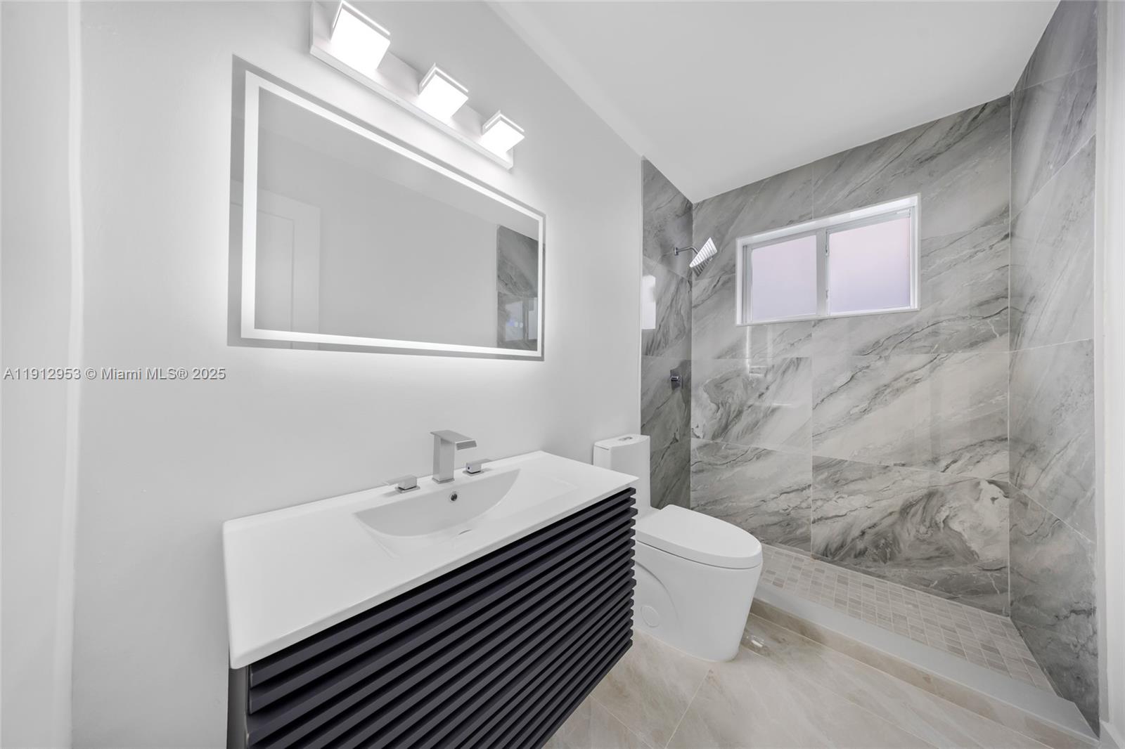 4500 Monroe Street Hollywood, FL 33021 - Photo 51 of 67 a bathroom with a sink a toilet and shower