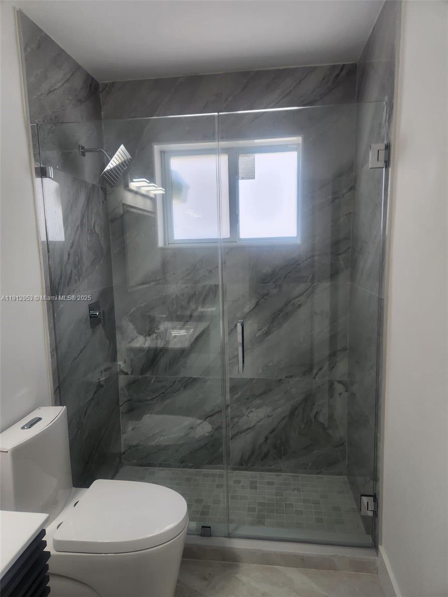 4500 Monroe Street Hollywood, FL 33021 - Photo 52 of 67 a bathroom with a toilet and a shower