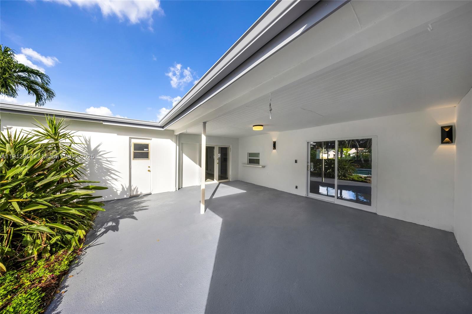 4500 Monroe Street Hollywood, FL 33021 - Photo 55 of 67 a view of a house with a yard and potted plants