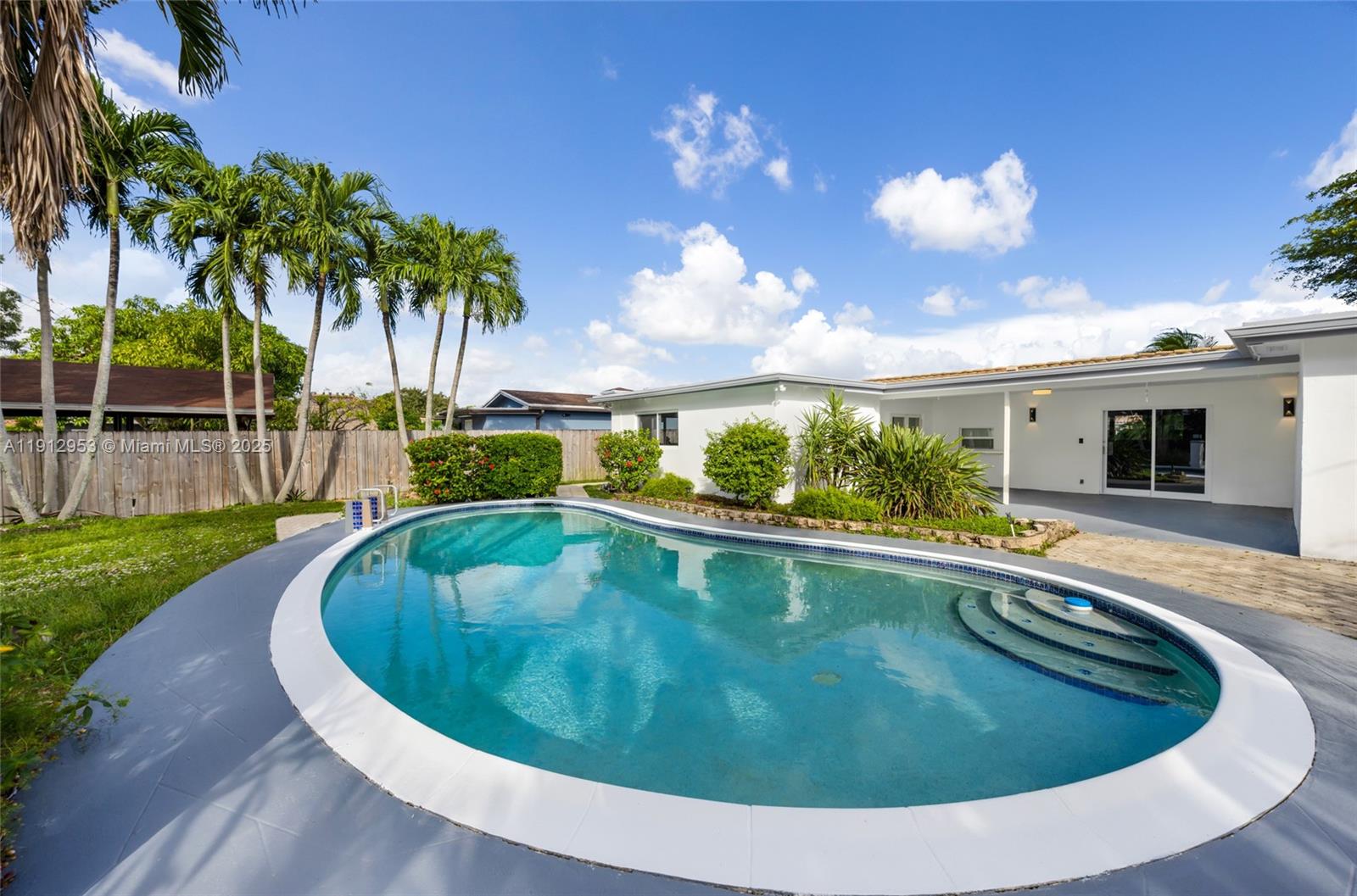4500 Monroe Street Hollywood, FL 33021 - Photo 60 of 67 a view of a swimming pool with a yard