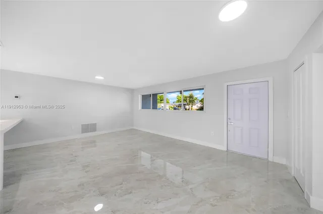a view of a hallway with a utility room
