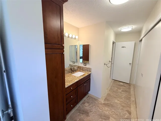 a bathroom with a double vanity sink and mirror